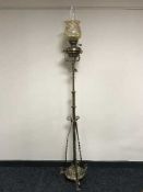 A Victorian rise and fall standard oil lamp with glass shade and chimney