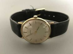 A Gents 9ct gold Omega centre seconds wristwatch, on black leather strap with Omega buckle,