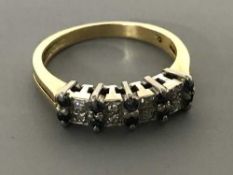 An 18ct gold sapphire and diamond ring