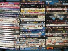 Three boxes of assorted DVDs