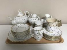 A tray of antique white and gilt tea service