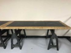Two contemporary trestle tables on industrial style legs
