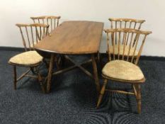 An Ercol elm drop leaf kitchen table and four chairs