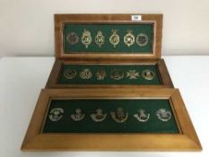 Three plaques of framed military regiment badges (eighteen)