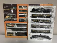 A boxed Lima HO scale banked bridge train set and Great Western locomotive and Pullman coaches