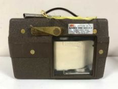 A Benzing Quartz automatic timing clock with key