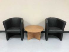 Four black faux leather tub chairs and a coffee table