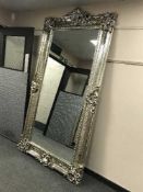 A very large silvered overmantel mirror,