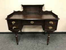 A continental oak desk on turned legs