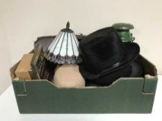A box of leather satchel, top hats, lady's vintage hats, metal tilley lamp,