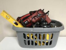 Two baskets of power tools, spirit levels, extension leads,