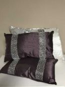 A large quantity of cushions, bed throws,