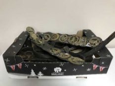 A box of horse brasses, horse tack, kettle,