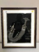 A cased Arabian Jambiya in sheath in a display frame