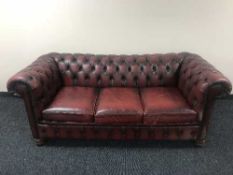 An oxblood leather Chesterfield settee