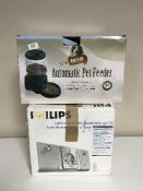 A boxed Philips stereo system and an automatic pet feeder