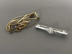 Two 18ct gold diamond set brooches, 7.