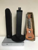 A set of Samsung surround sound speakers together with a Crown DVD player and a ukulele