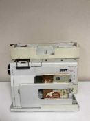 A cased Pfaff 1222 electric sewing machine