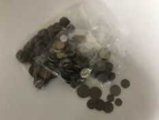 A box of four bags of British pre-decimal coins and foreign coins