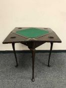 An Edwardian mahogany envelope card table