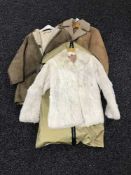 A sheepskin coat and a lady's fur coat