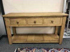 A reclaimed pine three drawer dresser