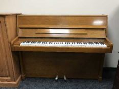 A walnut cased overstrung piano by Danemann