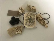A group of carvings to include netsukes, okimono etc.