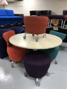 A circular pedestal office table,