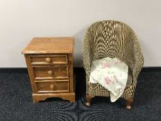 A three drawer bedside chest and a gold loom chair