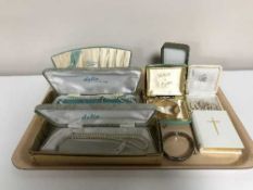 A tray and a jewellery box containing pearls, rolled gold bangles,