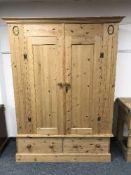 A double door pine wardrobe fitted two drawers
