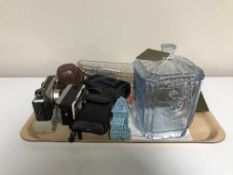 A tray of assorted cameras, continental glass lidded jar, pressed glass boat,