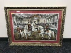 A large gilt framed needlework depicting military figures on horseback