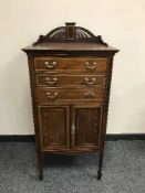 An inlaid mahogany Victorian music cabinet