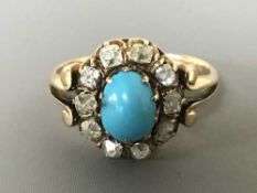 An antique turquoise and diamond cluster ring