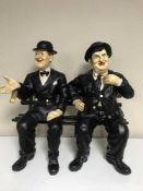 Two figures on a bench - Laurel and Hardy
