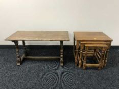 An oak refectory coffee table and nest of three oak tables