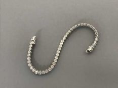 An 18ct white gold diamond line bracelet, 10.6g, the total diamond weight estimated at 1.