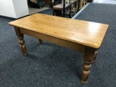 A rectangular pine coffee table