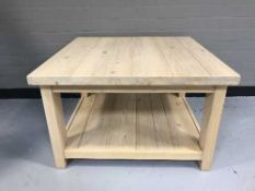 A pine two tier coffee table