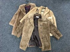 Two lady's fur coats and a simulated fur coat