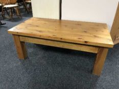 A rectangular pine coffee table