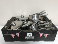 Two boxes of kitchen ware, pans, stainless steel dishes, utensils,