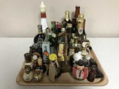 A tray of assorted alcohol miniatures, Newcastle Centenary bottle of Brown Ale, Pierre Water,