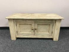 A painted pine double door storage chest