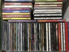 Three boxes of assorted CDs