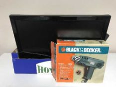 A box of two LCD TV with remotes, Black & Decker heat gun,
