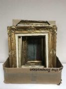 A box of ornate gilt picture frames